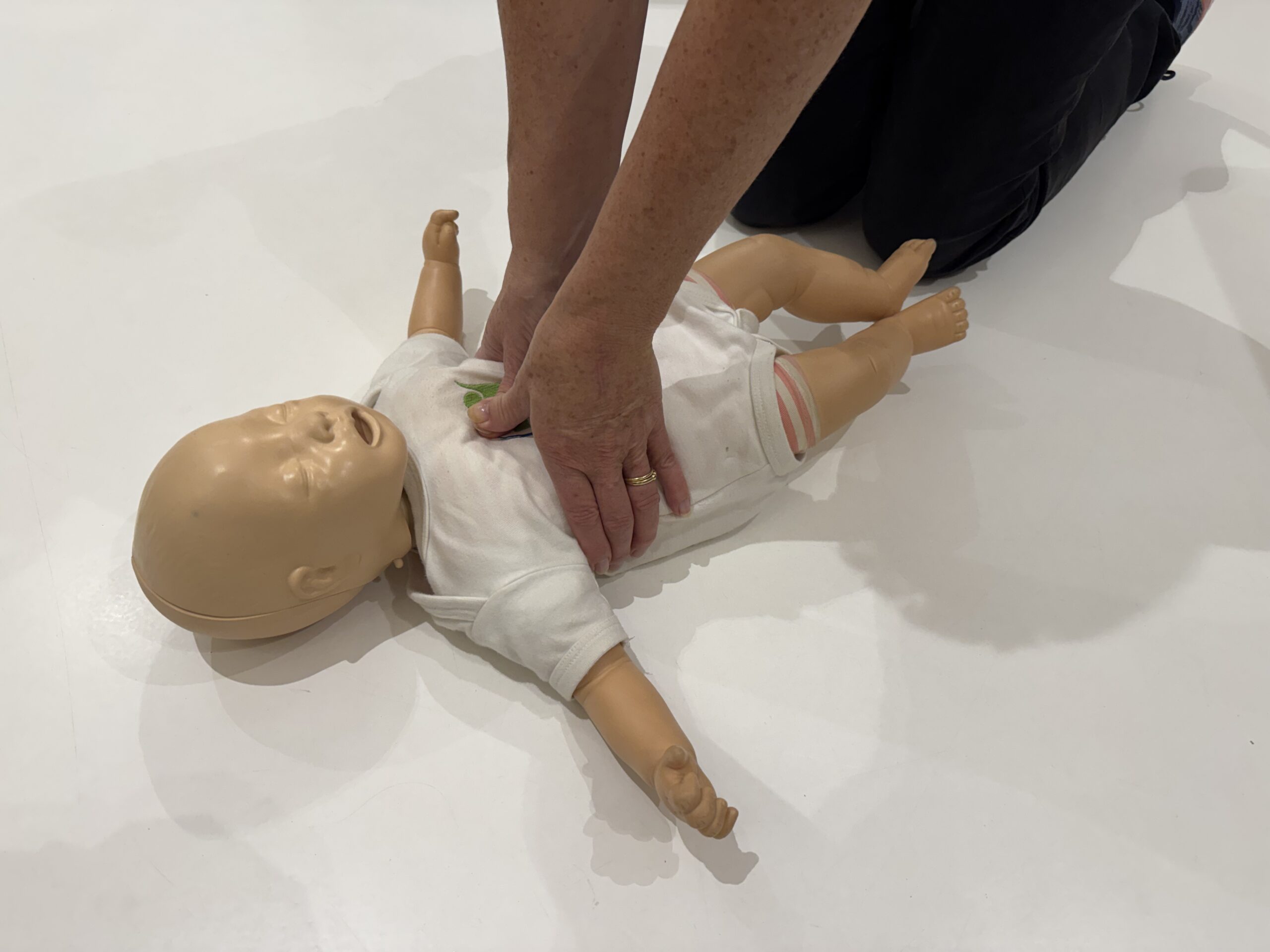 hand positioning for CPR on a baby